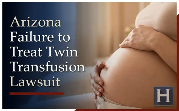 A pregnant woman gently cradles her belly, illustrating the serious questions families may have for an Arizona Failure to Treat Twin Transfusion lawyer.