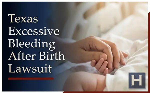 An adult's hand gently holds a baby's tiny hand in a soft setting, illustrating how a Texas Excessive Bleeding After Birth lawyer advocates for families.