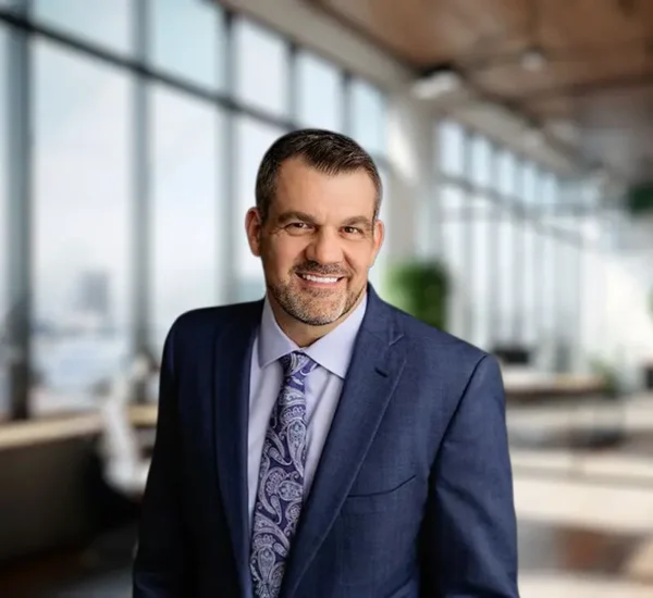 A portrait of Houston malpractice attorney Tommy Hastings in a conference room.
